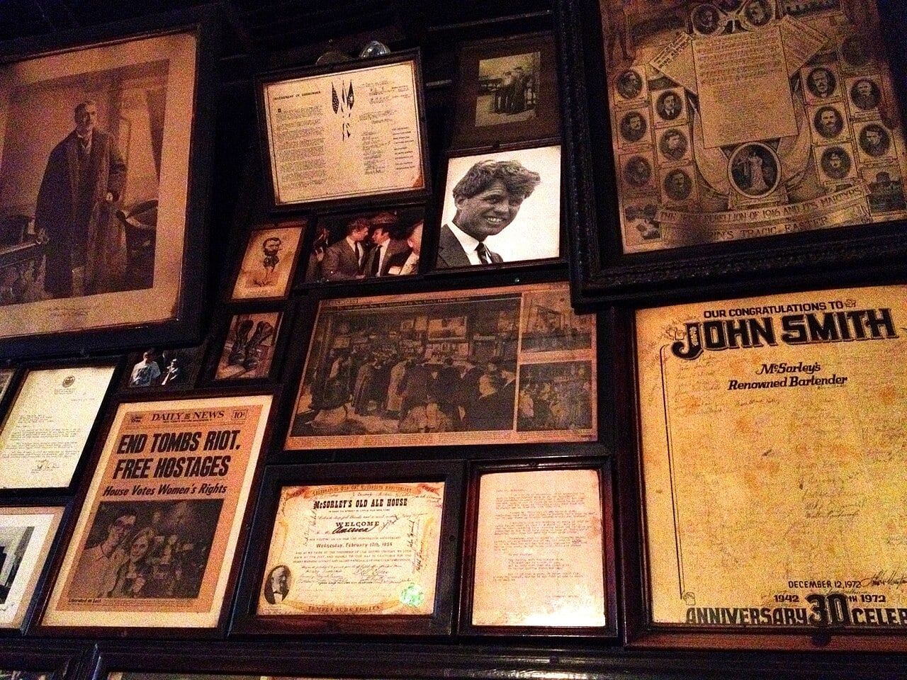 Framed photographs and newspaper clippings inside McSorley’s Old Ale House