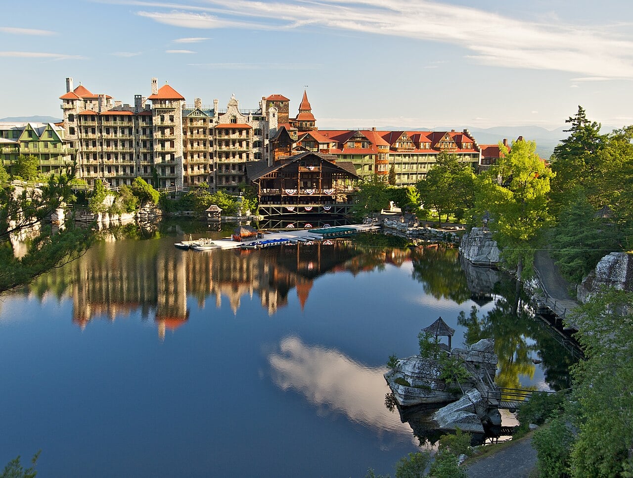 Mohonk Mountain House beside Lake Mohonk, with wooded hills behind the resort