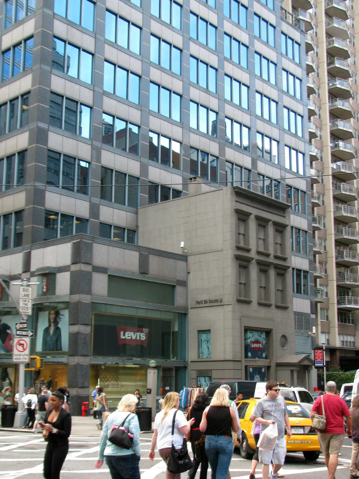 The small holdout house against the tower at 134 East 60th Street, photographed in 2012