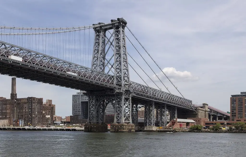 Williamsburg Bridge eastern tower and former Domino sugar refinery seen from the East River